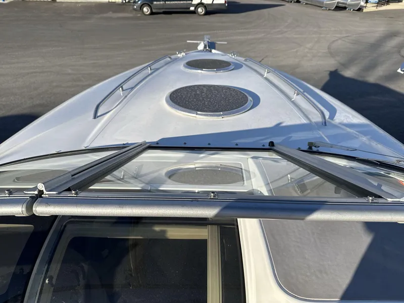 Slide: The Image of Cobalt 293 boat deck view, 2000 model, featuring circular hatches and sleek design. - 7