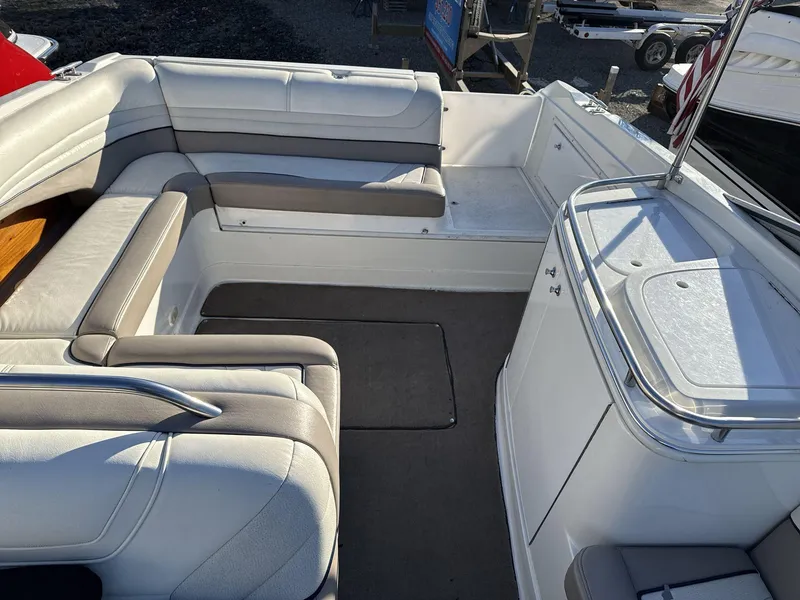 Slide: The Image of Interior of a 2000 Cobalt 293 boat with white and gray seating. - 8