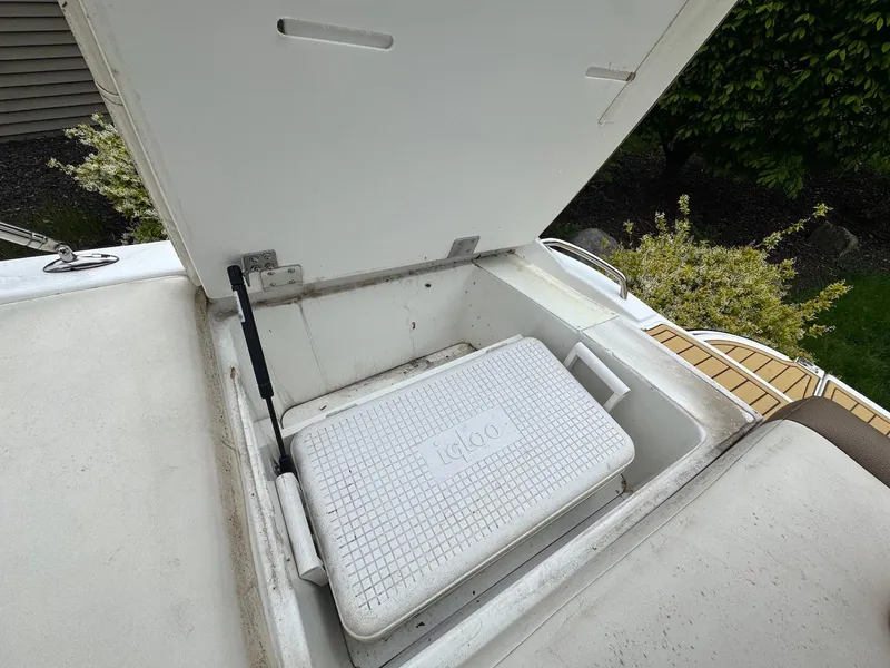 Slide: The Image of Open storage compartment on 2016 Cobalt 200S boat with Igloo cooler inside. - 15