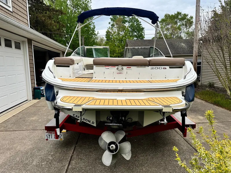 Slide: The Image of 2016 Cobalt 200S boat on trailer, parked in driveway, rear view. - 5