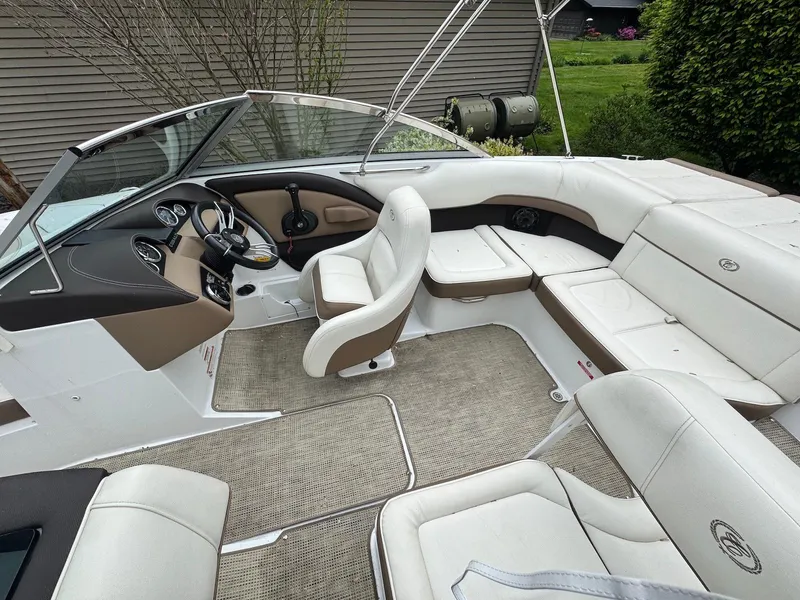 Slide: The Image of 2016 Cobalt 200S boat interior with white seating and beige accents. - 8