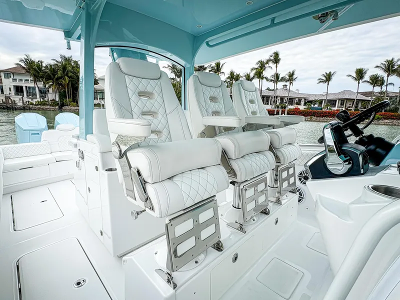 Slide: The Image of Luxury seating on 2023 HCB 42 Lujo boat, featuring elegant white upholstery. - 13