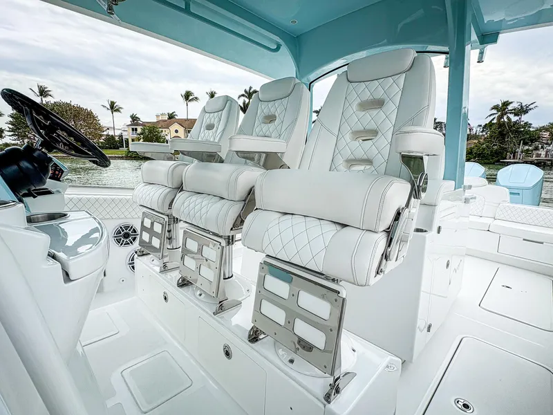 Slide: The Image of 2023 HCB 42 Lujo boat interior with luxurious white seating and modern design. - 14