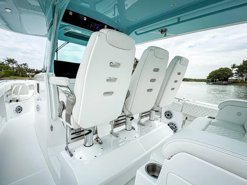 Slide: The Image of 2023 HCB 42 Lujo boat interior with white seating and modern design. - 15