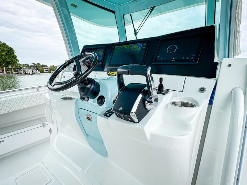 Slide: The Image of 2023 HCB 42 Lujo boat helm with modern controls and digital displays. - 18
