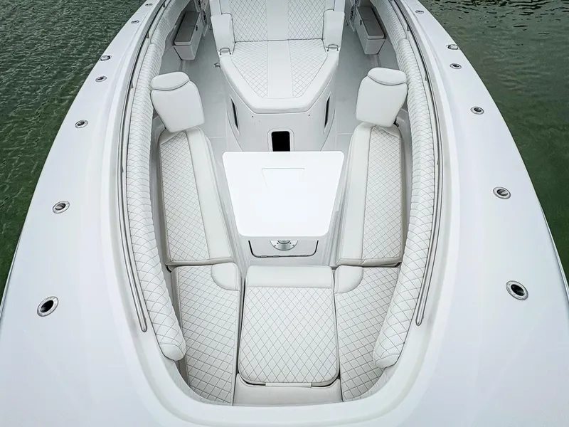 Slide: The Image of 2023 HCB 42 Lujo boat with luxurious white seating and sleek design. - 23