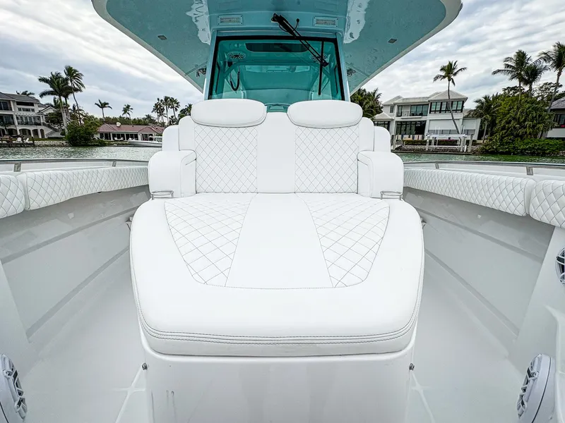 Slide: The Image of 2023 HCB 42 Lujo boat with luxurious white seating and elegant design. - 25