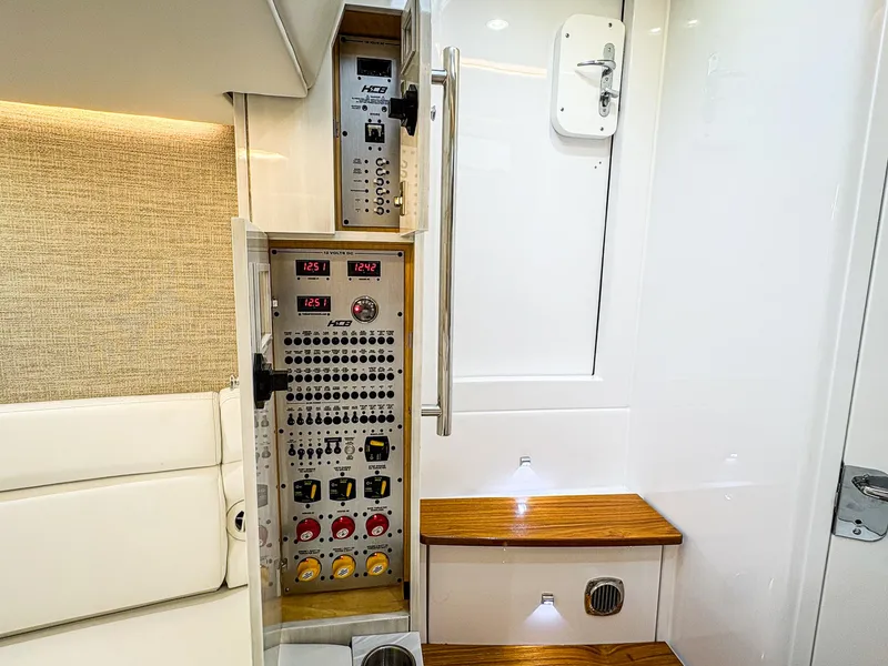 Slide: The Image of 2023 HCB 42 Lujo interior with control panel and wooden steps. - 29