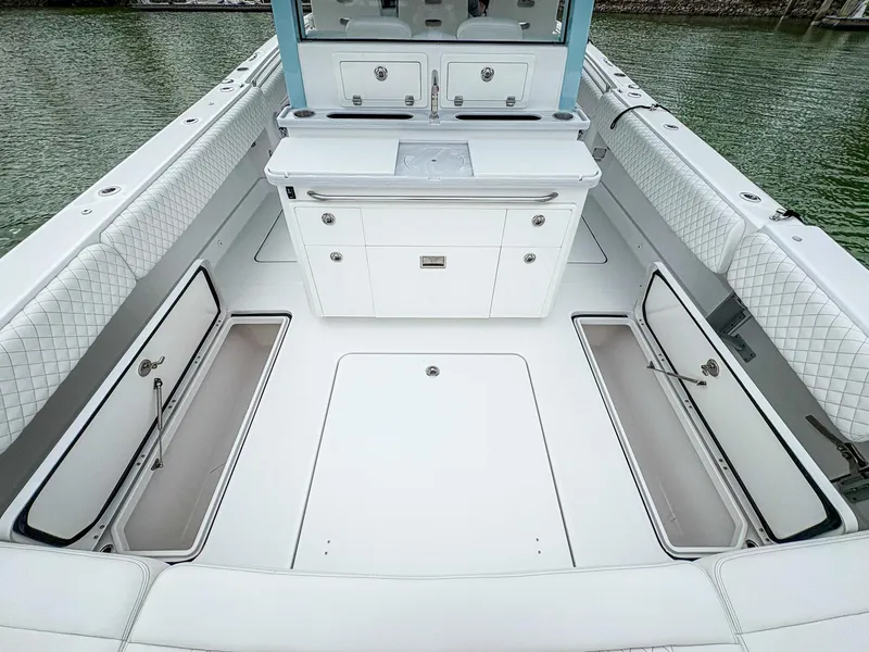 Slide: The Image of 2023 HCB 42 Lujo boat interior with open storage compartments and seating. - 32