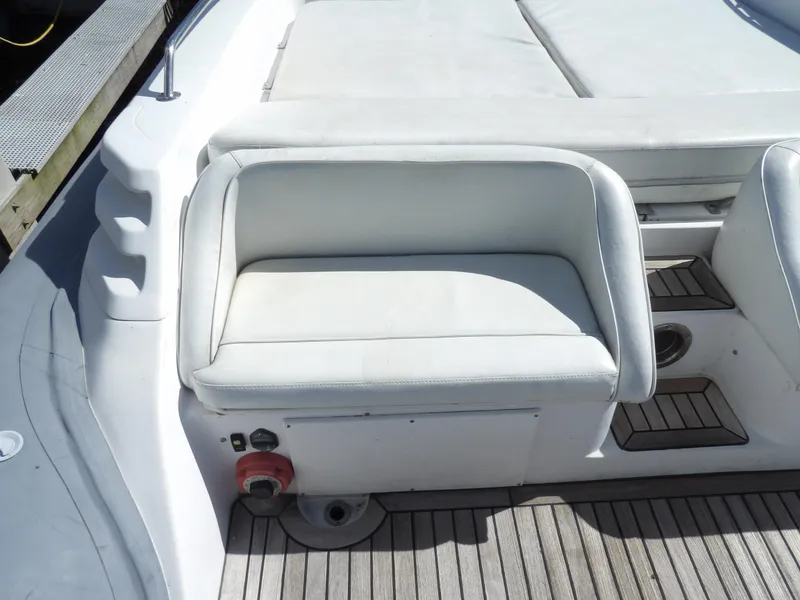 Slide: The Image of White seating area on 2004 SACS 42 boat with wooden deck. - 17