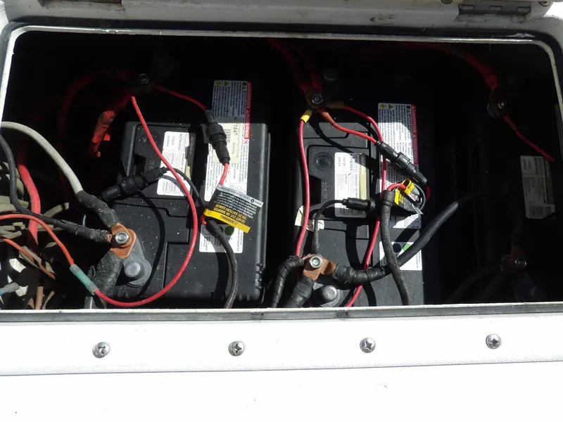 Slide: The Image of Battery compartment of a 2004 SACS 42 boat with connected wiring. - 18