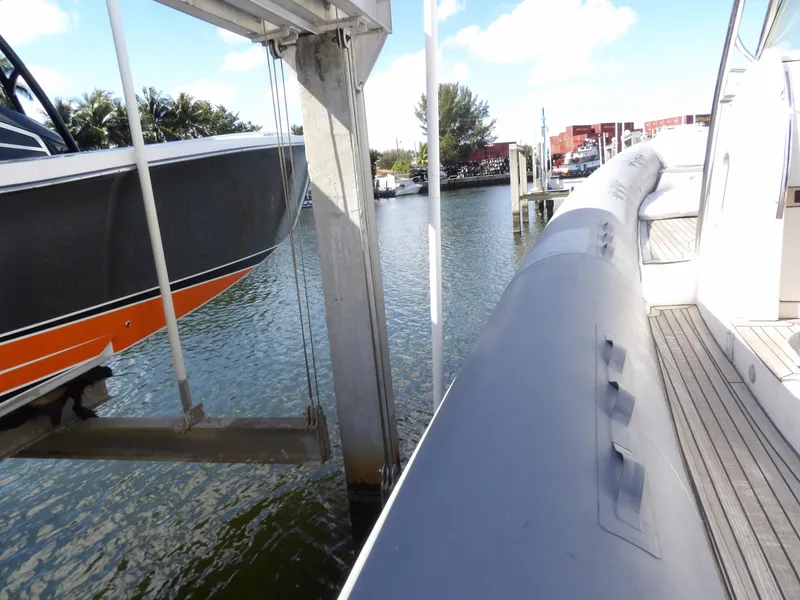 Slide: The Image of SACS 42 boat docked at marina, side view, 2004 model. - 21