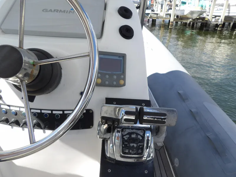 Slide: The Image of Control panel of a 2004 SACS 42 boat with Garmin equipment. - 25