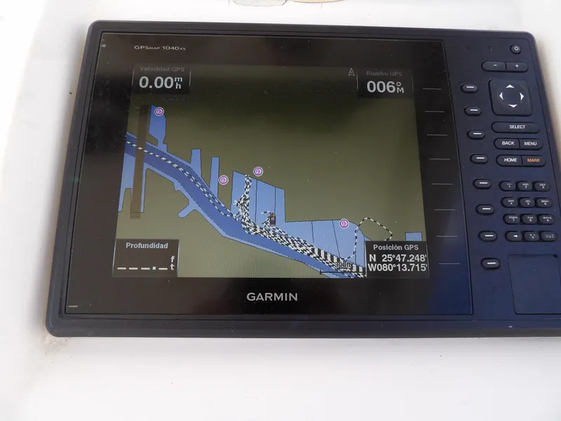 Slide: The Image of Garmin GPS display on a 2004 SACS 42 boat, showing navigation map and coordinates. - 27