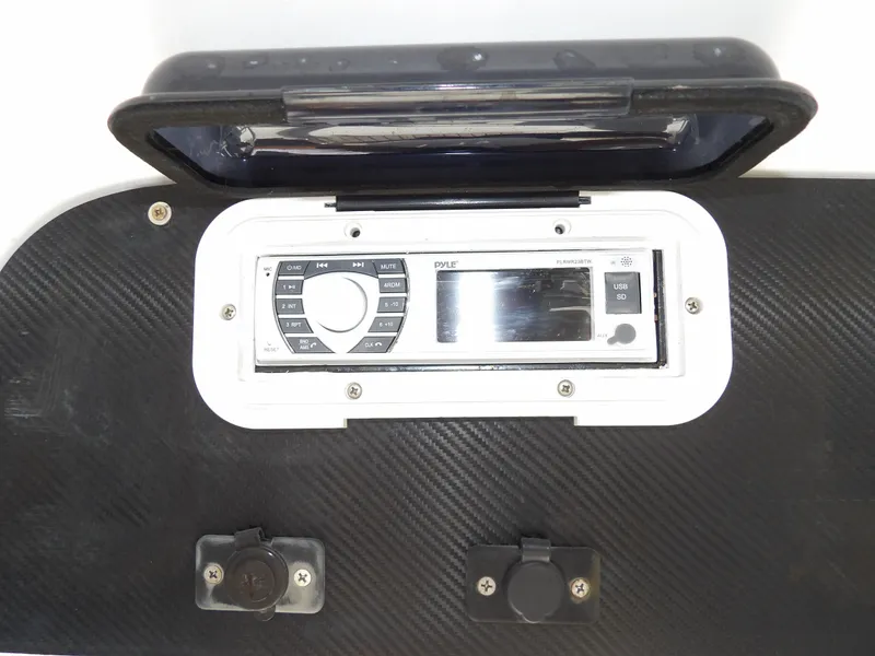 Slide: The Image of Control panel of a 2004 SACS 42 boat with a stereo system. - 28
