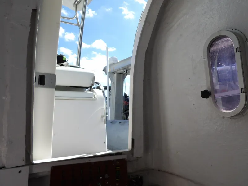 Slide: The Image of Interior view of 2004 SACS 42 boat, showing cabin entrance and porthole window. - 38