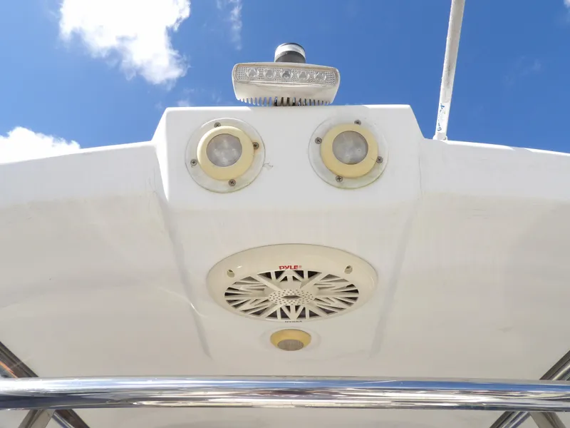 Slide: The Image of 2004 SACS 42 boat's speaker and lights under a clear blue sky. - 39