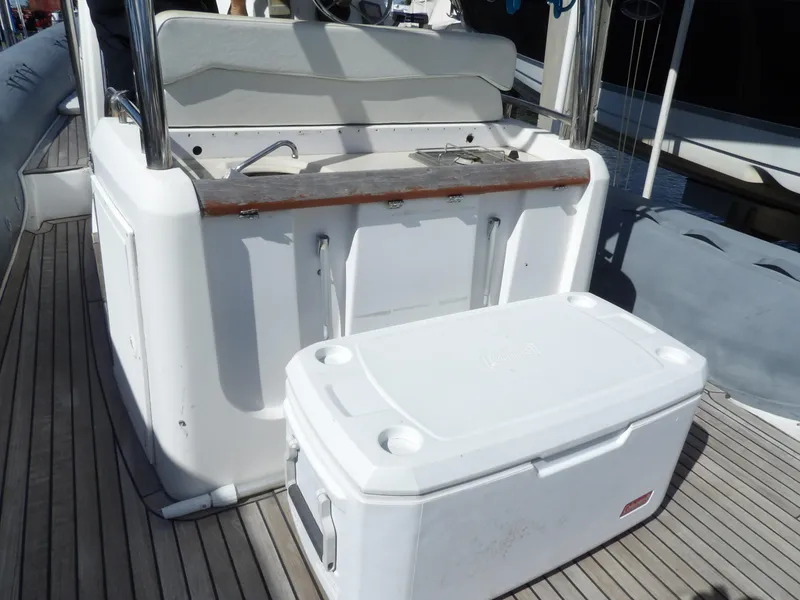 Slide: The Image of 2004 SACS 42 boat deck with cooler and seating area. - 43