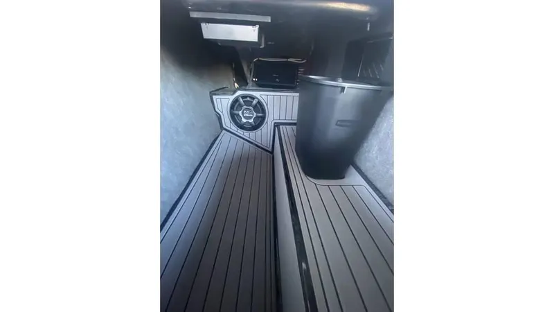 Slide: The Image of 2014 Nautique Super Air Nautique G23 interior with sleek flooring and modern design. - 11