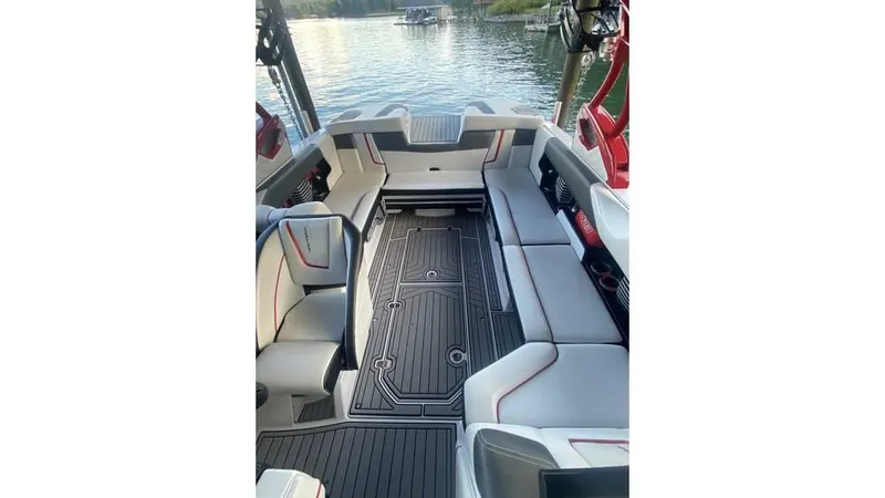 Slide: The Image of 2014 Nautique Super Air Nautique G23 interior with sleek seating and lake view. - 12