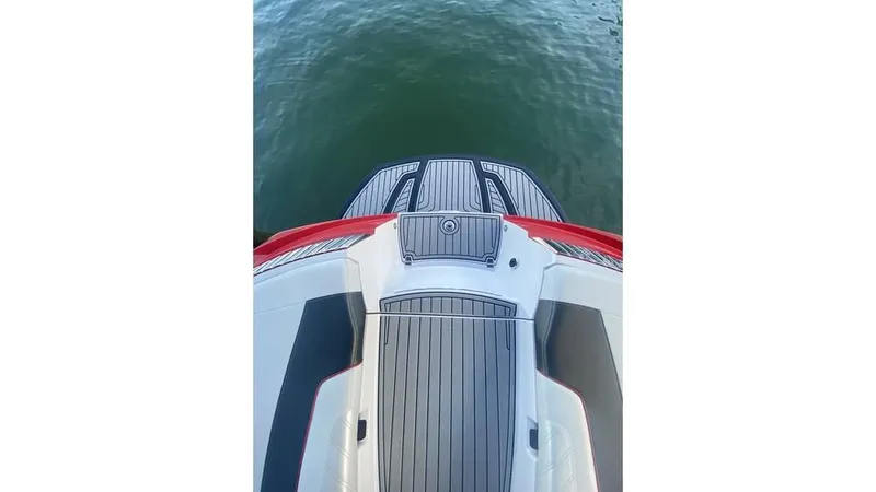 Slide: The Image of 2014 Nautique Super Air Nautique G23 boat deck, overlooking calm water. - 15