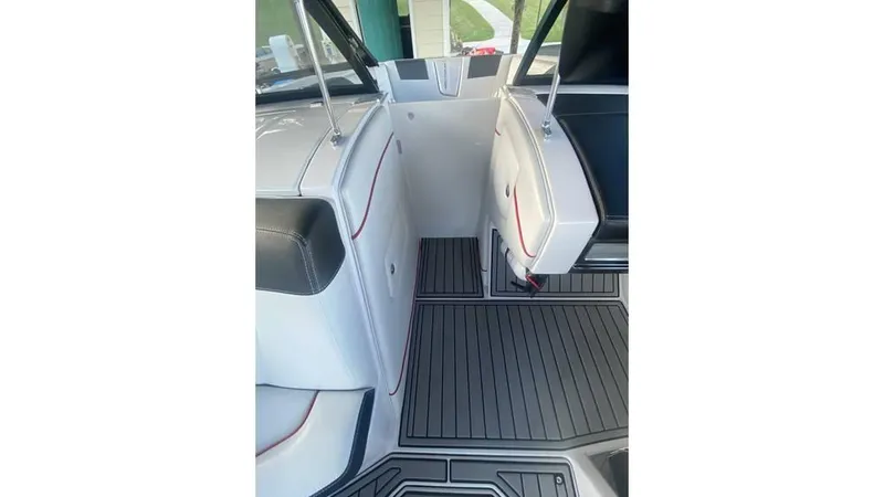 Slide: The Image of 2014 Nautique Super Air Nautique G23 interior with sleek seating and flooring design. - 4