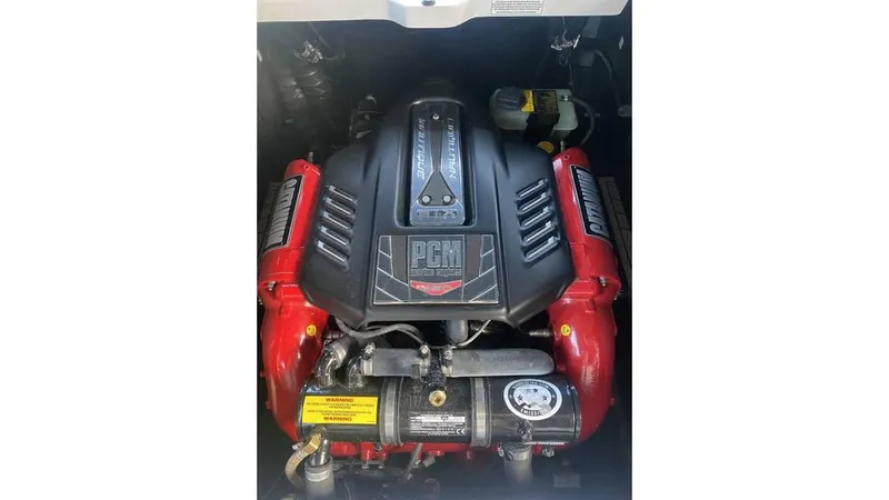 Slide: The Image of 2014 Nautique Super Air Nautique G23 engine, PCM model, with red and black components. - 6