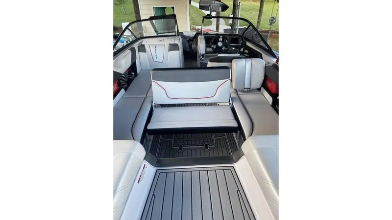 Slide: The Image of 2014 Nautique Super Air Nautique G23 interior with sleek seating and modern dashboard. - 7