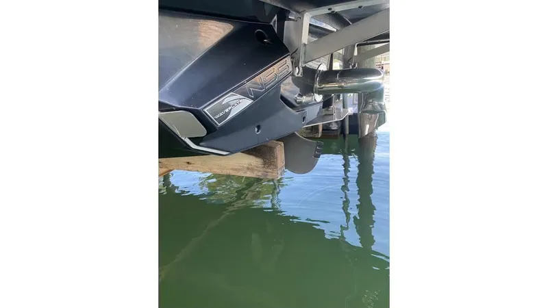 Slide: The Image of 2014 Nautique Super Air Nautique G23 boat hull and propeller in water. - 9