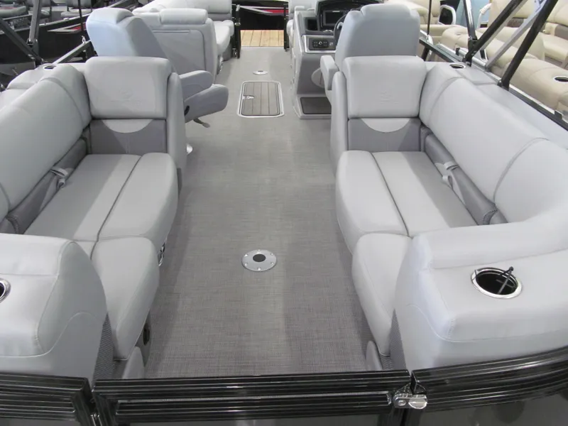 Slide: The Image of 2025 Regency 230 DL3 pontoon boat interior with gray seating and modern design. - 6
