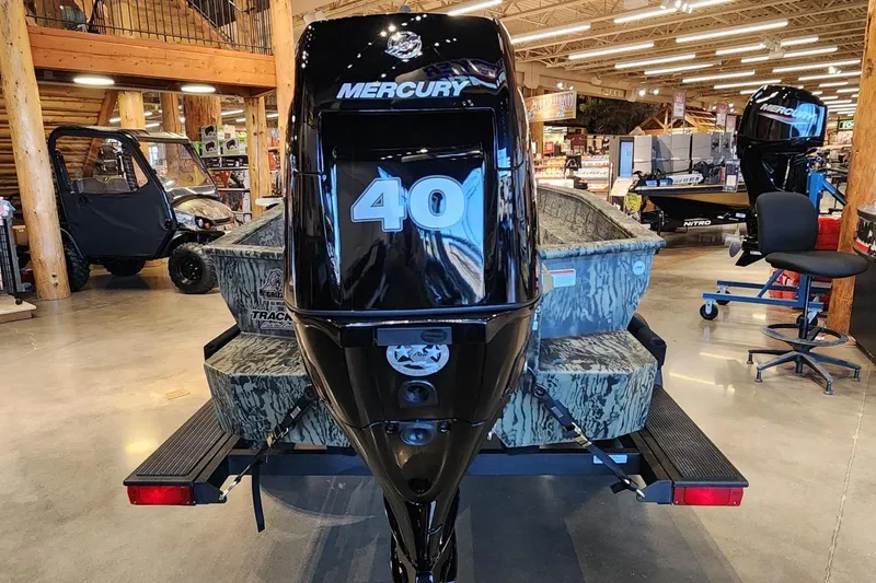 Slide: The Image of 2025 Tracker Grizzly 1650 T Prairie Wings Edition with Mercury 40 engine in showroom. - 3