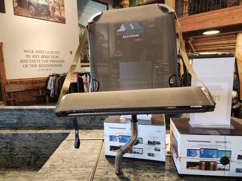 Slide: The Image of 2025 Tracker Grizzly 1650 T Prairie Wings Edition seat in a showroom display. - 5