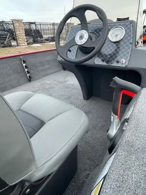 Slide: The Image of 2025 Tracker Bass Tracker Classic XL boat interior with steering wheel and seat. - 4