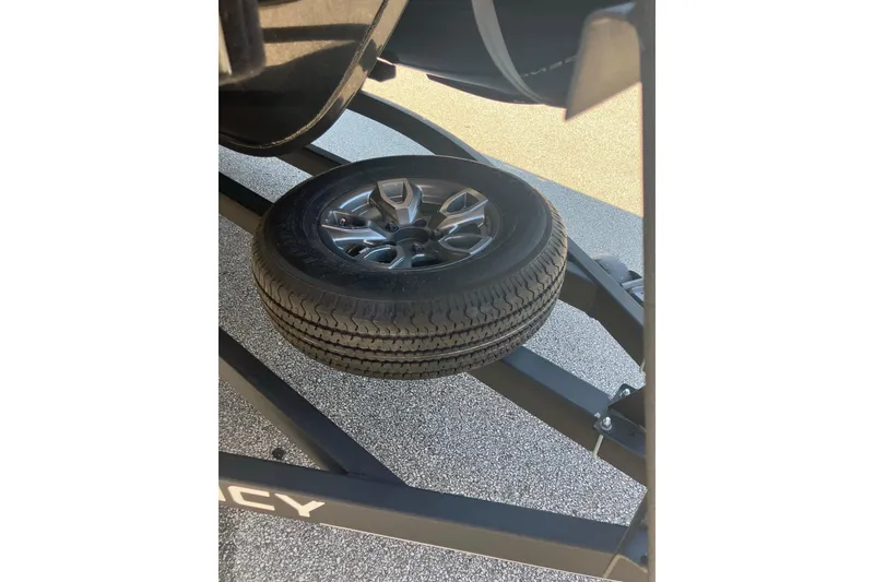 Slide: The Image of Spare tire mounted on a 2025 Regency 250 DL3 trailer frame. - 4