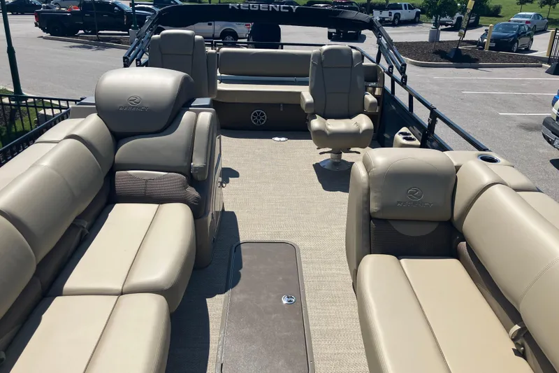 Slide: The Image of Luxurious 2025 Regency 250 DL3 pontoon boat with spacious seating and elegant design. - 10