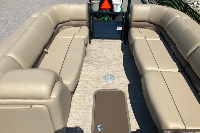 Slide: The Image of Luxurious seating on 2025 Regency 250 DL3 pontoon boat, featuring beige upholstery. - 11