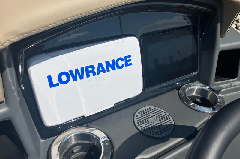 Slide: The Image of Dashboard of 2025 Regency 250 DL3 featuring Lowrance Hook display and cup holders. - 13