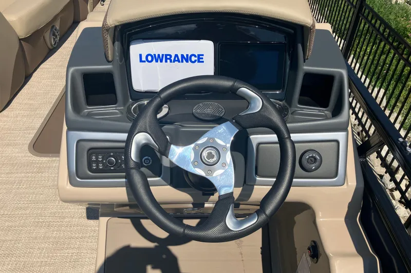 Slide: The Image of Steering console of 2025 Regency 250 DL3 boat with Lowrance display. - 12