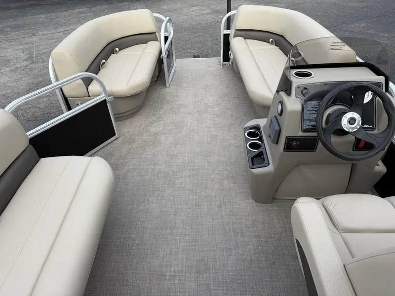 Slide: The Image of 2025 Sun Tracker Party Barge 16 DLX interior with spacious seating and modern helm. - 12