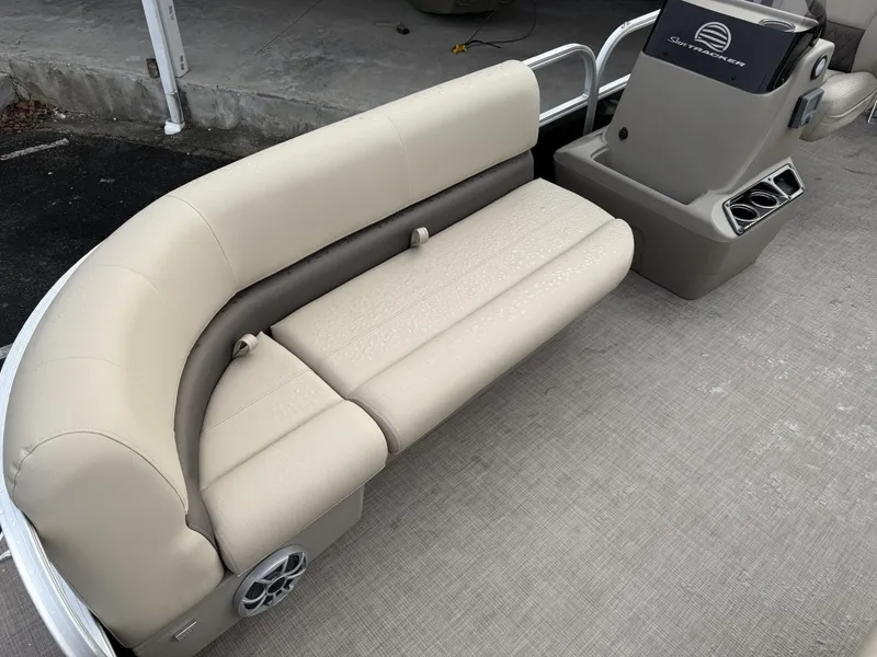 Slide: The Image of 2025 Sun Tracker Party Barge 16 DLX with beige seating and console. - 5