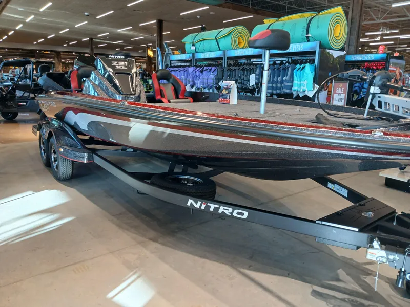 The Image of 2025 Nitro Z21 XL boat displayed in a showroom with vibrant lighting. - 0