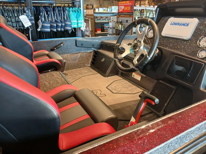 Slide: The Image of 2025 Nitro Z21 XL boat interior with red and black seats, steering wheel, and Lowrance display. - 10