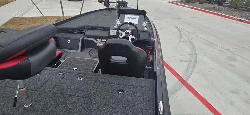 Slide: The Image of 2025 Nitro Z21 XL boat interior with steering wheel and seating. - 4