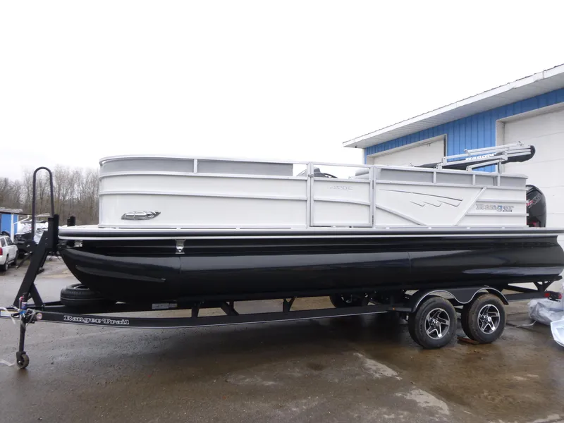 The Image of 2025 Ranger Reata 220C pontoon boat on trailer, parked outdoors. - 0