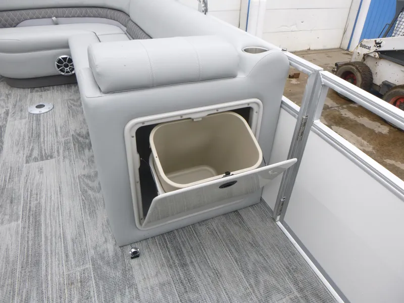 Slide: The Image of 2025 Ranger Reata 220C pontoon boat interior with gray seating and wood-style flooring. - 13