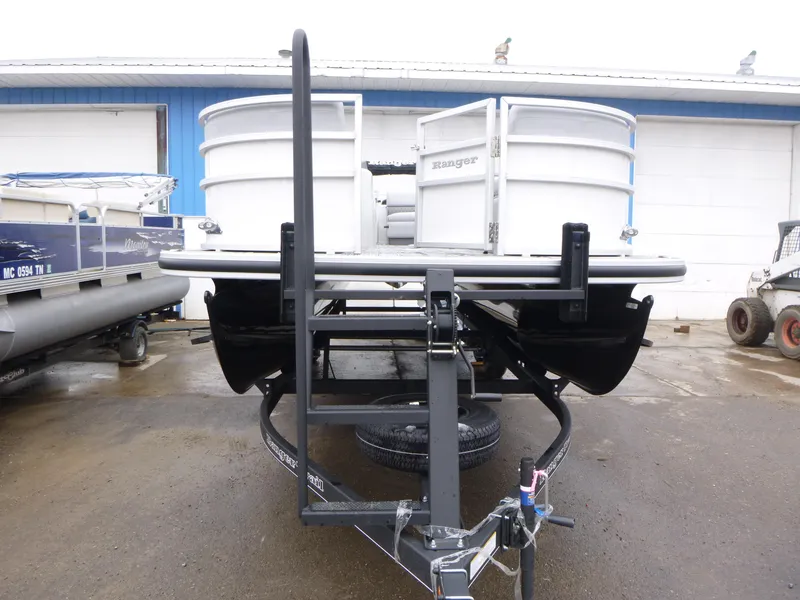 Slide: The Image of 2025 Ranger Reata 220C pontoon boat with powerful outboard motor, displayed on a trailer. - 3
