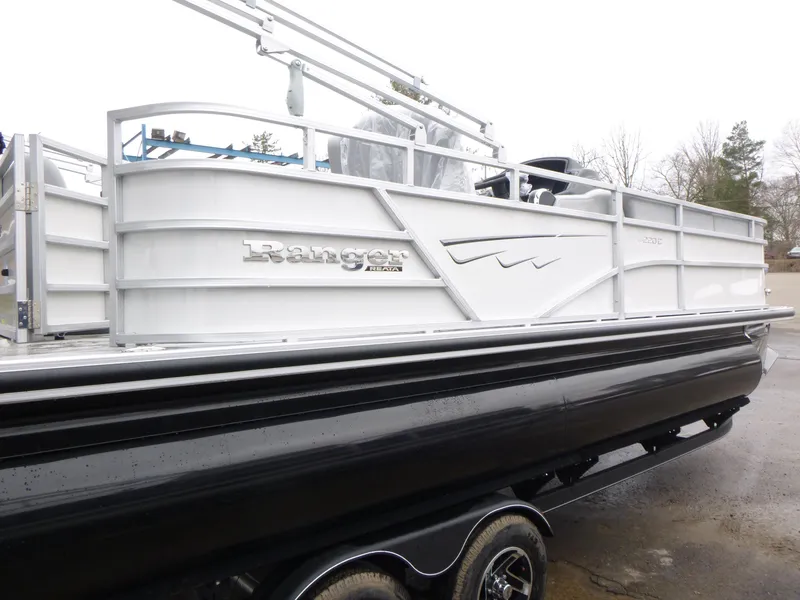 Slide: The Image of 2025 Ranger Reata 220C boat deck with motor and ladder. - 5