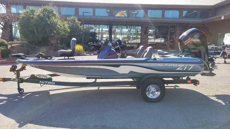 Slide: The Image of 2025 Nitro Z17 boat on trailer, parked outdoors. - 2