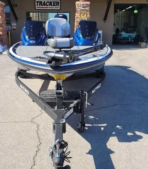 Slide: The Image of 2025 Nitro Z17 boat on trailer outside Tracker dealership. - 5