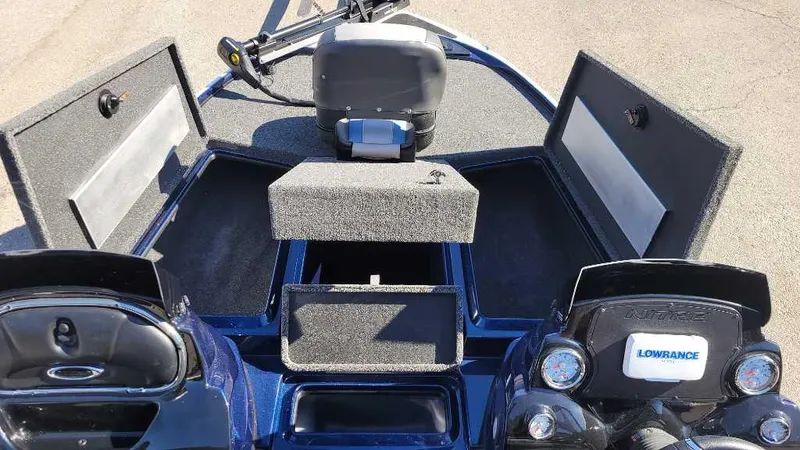 Slide: The Image of 2025 Nitro Z17 boat interior with open storage compartments and Lowrance electronics. - 6